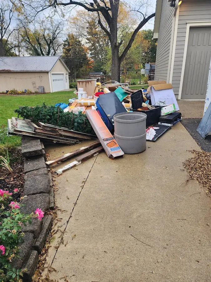 Dumpster being loaded with debris for Demolition Dumpster Rental in Cumru